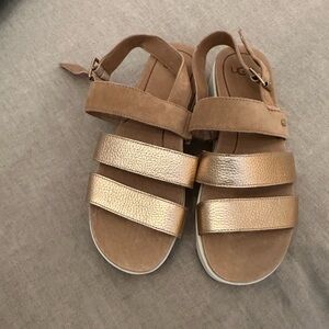 UGG sandals in Gold size 8.5